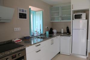 Kuchyň nebo kuchyňský kout v ubytování Casinha Verde