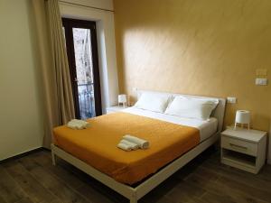 Giường trong phòng chung tại Giò Rooms