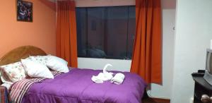 Postel nebo postele na pokoji v ubytování Kaboka Cusco Hospedaje Familiar + 7 fotografií