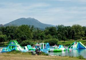 a bunch of inflatables in the water at a park at Maison Chêne Liège in Maureillas