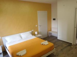 Giường trong phòng chung tại Giò Rooms