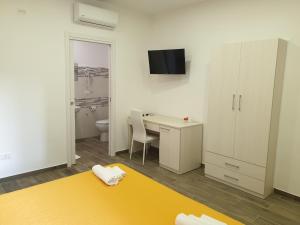 Giường trong phòng chung tại Giò Rooms
