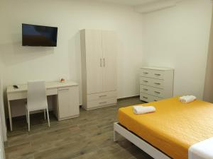 Giường trong phòng chung tại Giò Rooms
