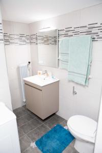 a white bathroom with a sink and a toilet at Acropolis,Historic center Apartment-update in Athens