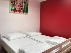 Ένα ή περισσότερα κρεβάτια σε δωμάτιο στο Bowling Hostel