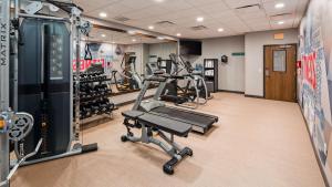 a gym with treadmills and machines in a room at Best Western Plus Rapid City Rushmore in Rapid City