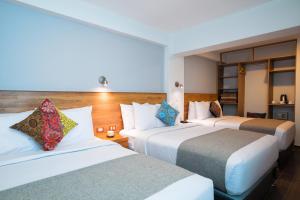 Katil atau katil-katil dalam bilik di Muru Homely Hotel Cusco