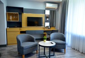 TV a/nebo společenská místnost v ubytování Hotel Konak