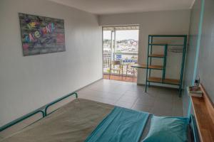 Postel nebo postele na pokoji v ubytování Auberge Jeunesse Nouméa