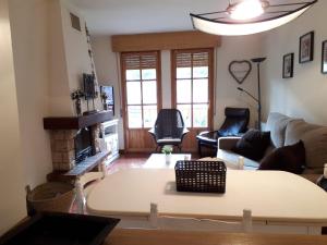 a living room with a couch and a table at Biescas San Roque in Biescas