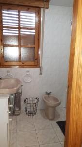 a bathroom with a sink and a toilet in it at Biescas San Roque in Biescas