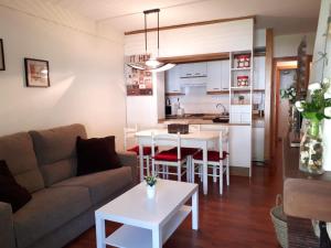 a living room with a couch and a table at Biescas San Roque in Biescas
