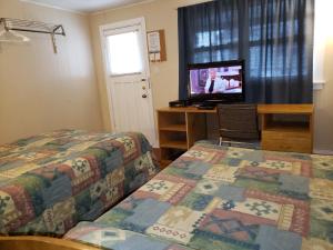 Postel nebo postele na pokoji v ubytování Regent Motel