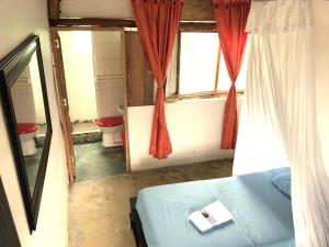 Postel nebo postele na pokoji v ubytování Moon Wind Tayrona Hostel