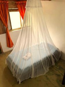Postel nebo postele na pokoji v ubytování Moon Wind Tayrona Hostel