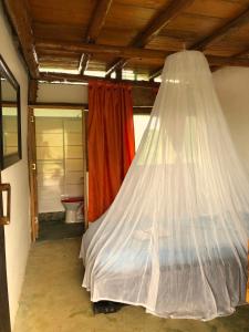 Postel nebo postele na pokoji v ubytování Moon Wind Tayrona Hostel