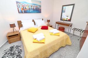 a bedroom with a bed with two towels on it at Vila Mila in Vela Luka