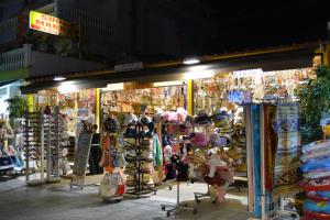 a store with a bunch of hats and other merchandise at GLIKERIA ROOMS in Olympic Beach