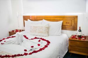 Postel nebo postele na pokoji v ubytování Hotel Estación Sabana