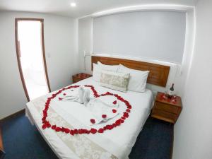 Postel nebo postele na pokoji v ubytování Hotel Estación Sabana