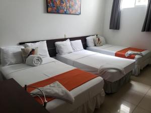 Łóżko lub łóżka w pokoju w obiekcie Hotel Arbol de Sueños