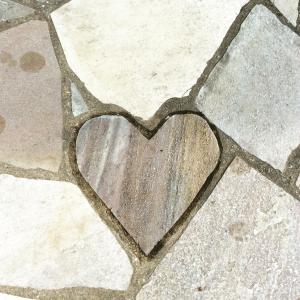 a heart on the floor of a sidewalk at Nagasaki Chapel Coconuts Hotel ＆Resort in Isahaya