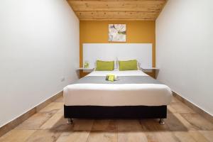 Postel nebo postele na pokoji v ubytování Hotel Casa Normandia
