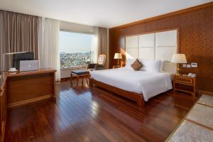 Giường trong phòng chung tại Samdi Da Nang Central Hotel