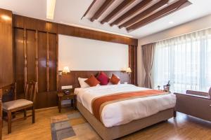 Llit o llits en una habitació de Landmark Pokhara