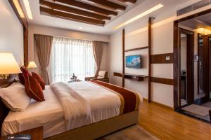 Llit o llits en una habitació de Landmark Pokhara