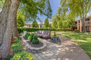 a park with a bench under a tree at Quality Inn Exit 4 Clarksville in Clarksville