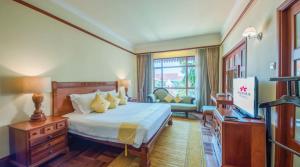 Postel nebo postele na pokoji v ubytování Sokha Angkor Resort
