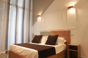 Posteľ alebo postele v izbe v ubytovaní Be Italian Flat Piazza Bovio 22