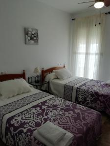 Postel nebo postele na pokoji v ubytování El Descanso + 9 fotografií