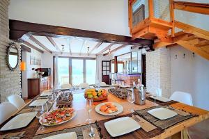 a dining room with a table with fruits and wine glasses at Secrets Rural House in Jávea