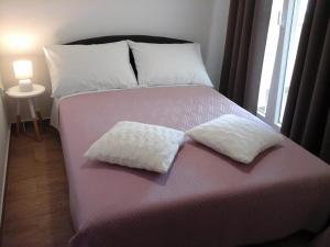 Postel nebo postele na pokoji v ubytování Apartman Krešo i Niko
