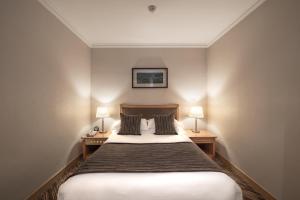 Postel nebo postele na pokoji v ubytování Xiyuan Hotel