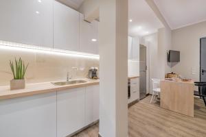 Kuchyňa alebo kuchynka v ubytovaní Cosy apartment in the heart of the city centre + 7 fotografií