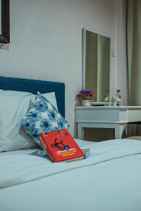 Postel nebo postele na pokoji v ubytování The Grace House Chiangmai