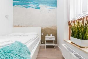 Posteľ alebo postele v izbe v ubytovaní Apartments Gdańsk Starowiejska by Noclegi Renters