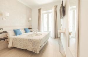 A bed or beds in a room at Hostal Pio Centro
