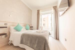 A bed or beds in a room at Hostal Pio Centro