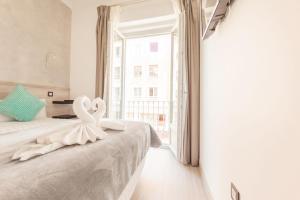 A bed or beds in a room at Hostal Pio Centro