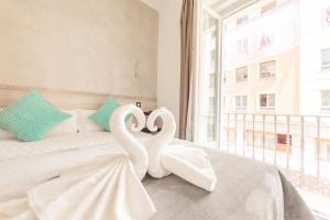 A bed or beds in a room at Hostal Pio Centro