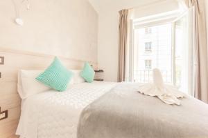 A bed or beds in a room at Hostal Pio Centro
