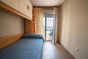 Posteľ alebo postele v izbe v ubytovaní Apartamento Paseo Maritimo 27