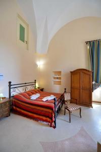 מיטה או מיטות בחדר ב-Agriturismo Santa Chiara
