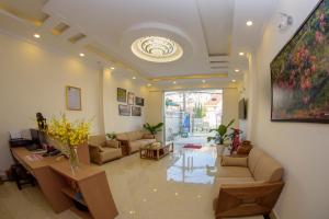 a large living room with couches and a table at Khánh Minh Hotel in Da Lat