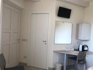 TV a/nebo společenská místnost v ubytování B&B Isola Verde