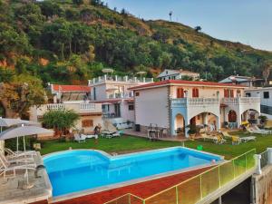 a villa with a swimming pool and a mountain at Villa Fontana in Tropea